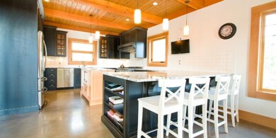 Alder painted and distressed cabinets with a natural fir island