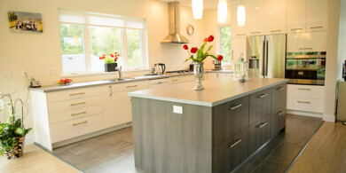 High gloss white slab cabinets with textured melamine island